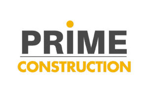 Logo with the word "PRIME" in bold gray letters and "CONSTRUCTION" in bold yellow letters below. The dot over the "I" in "PRIME" is also yellow. The background is transparent.
